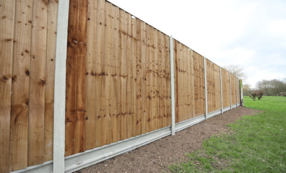 How to install concrete slotted fence posts and gravel boards
